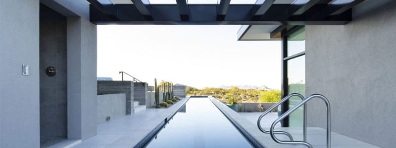 A pool with a view of the desert.