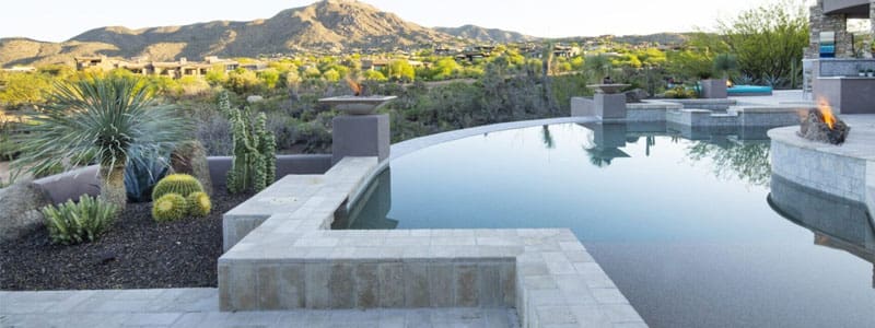 A pool with a view of the mountains