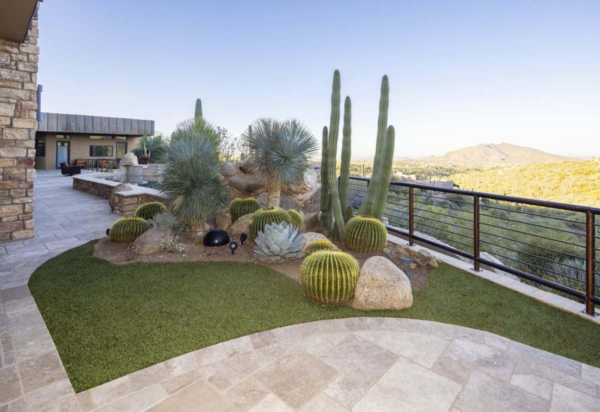 A patio with a view of the desert and mountains.