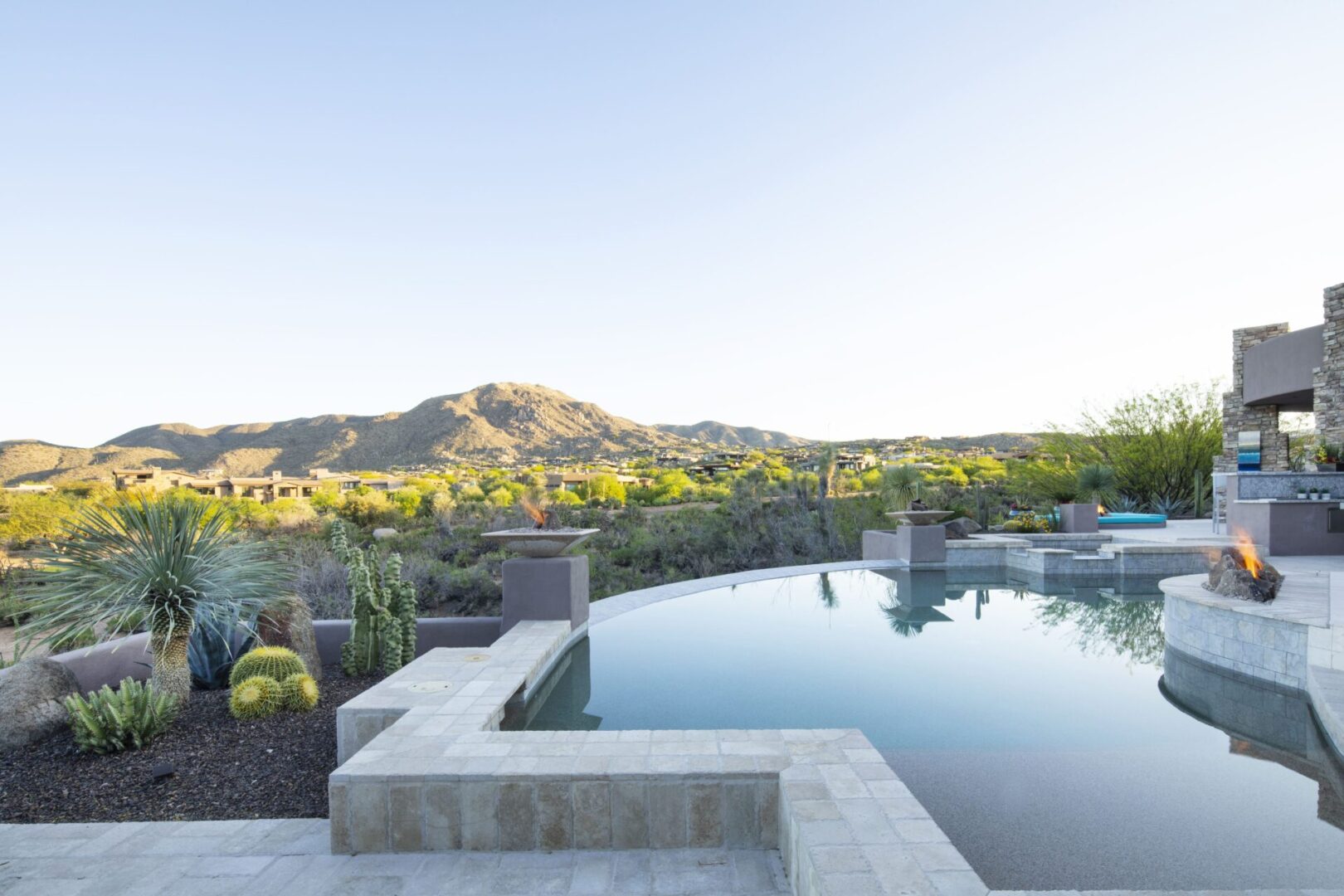 A pool with a view of the mountains in the background.