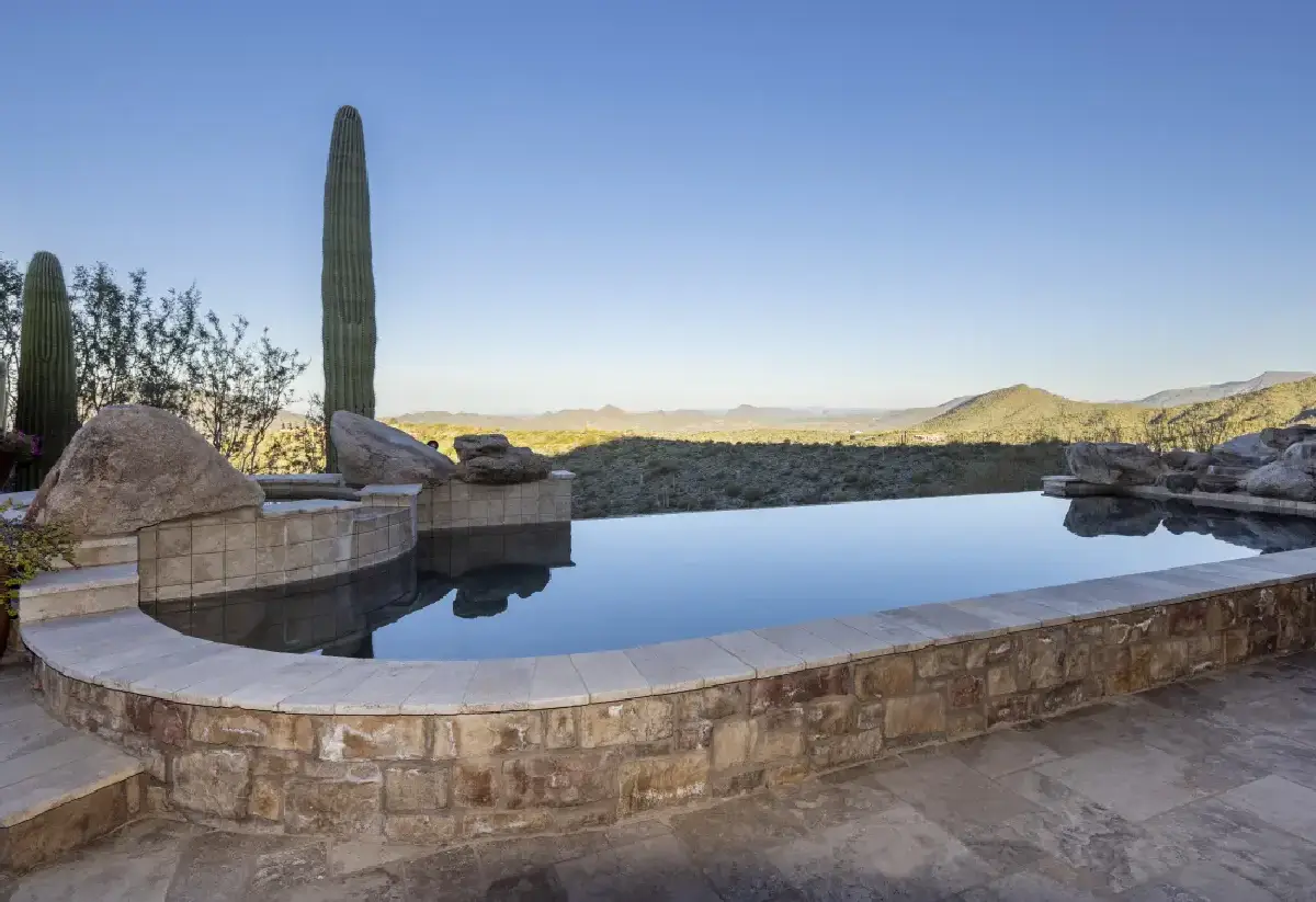 A pool with a view of the desert.