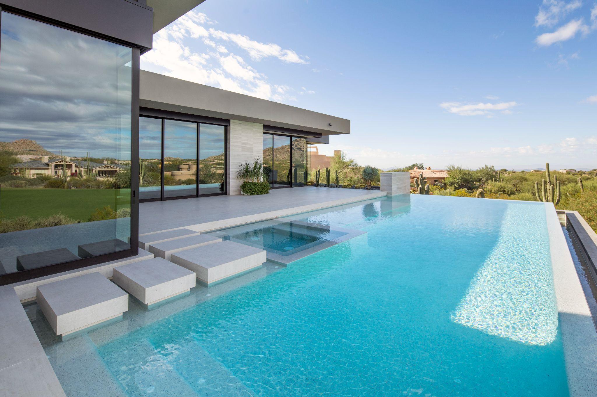 Contemporary infinity-edge pool overlooking desert landscape
