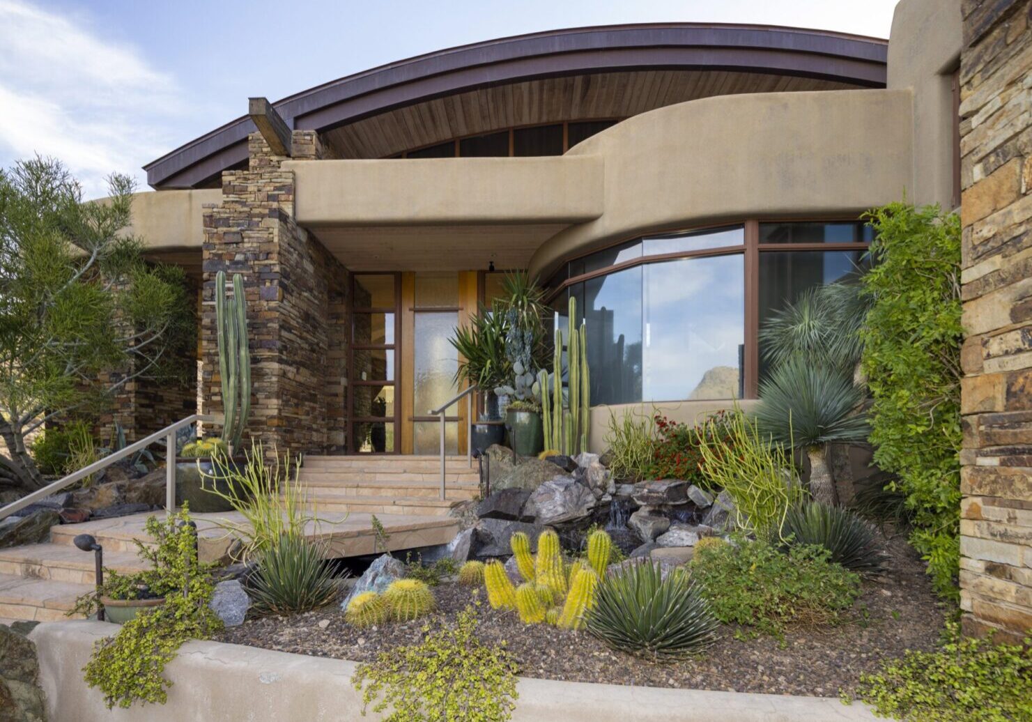 A house with a garden and plants in front of it